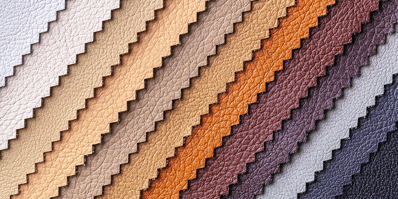 Sample of leather textile brown and gray colors, background.